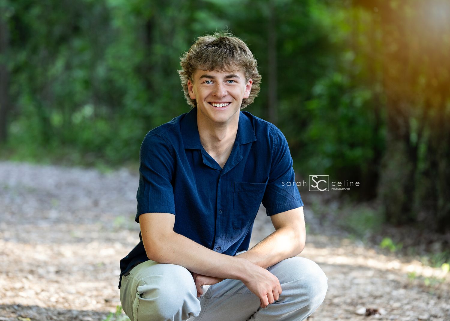 A casual outdoor photo series taken in a leafy setting featuring someone wearing navy blue attire.