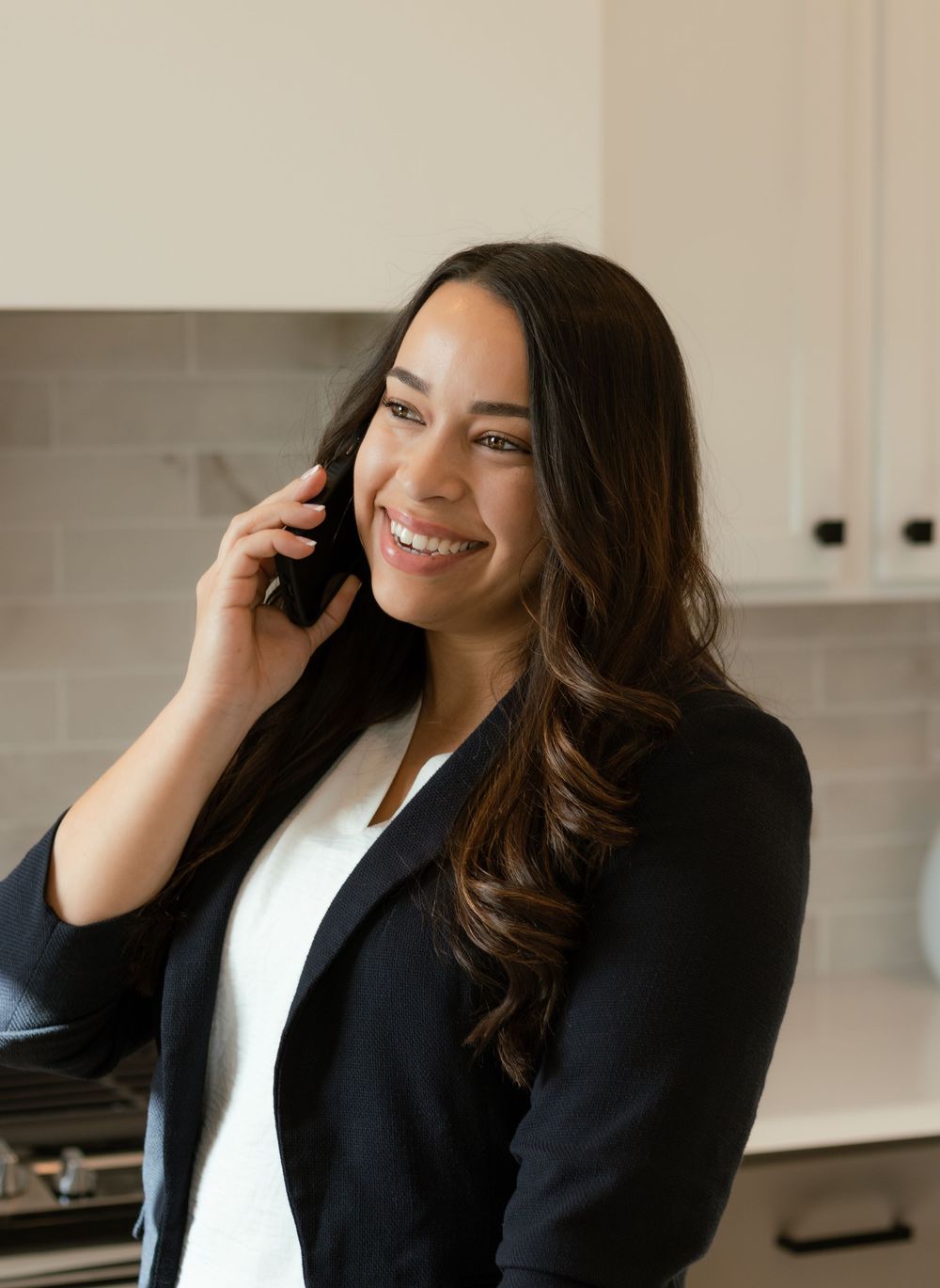 Lifestyle branding shot of realtor taking a business call during in-home photo session in Kennewick WA