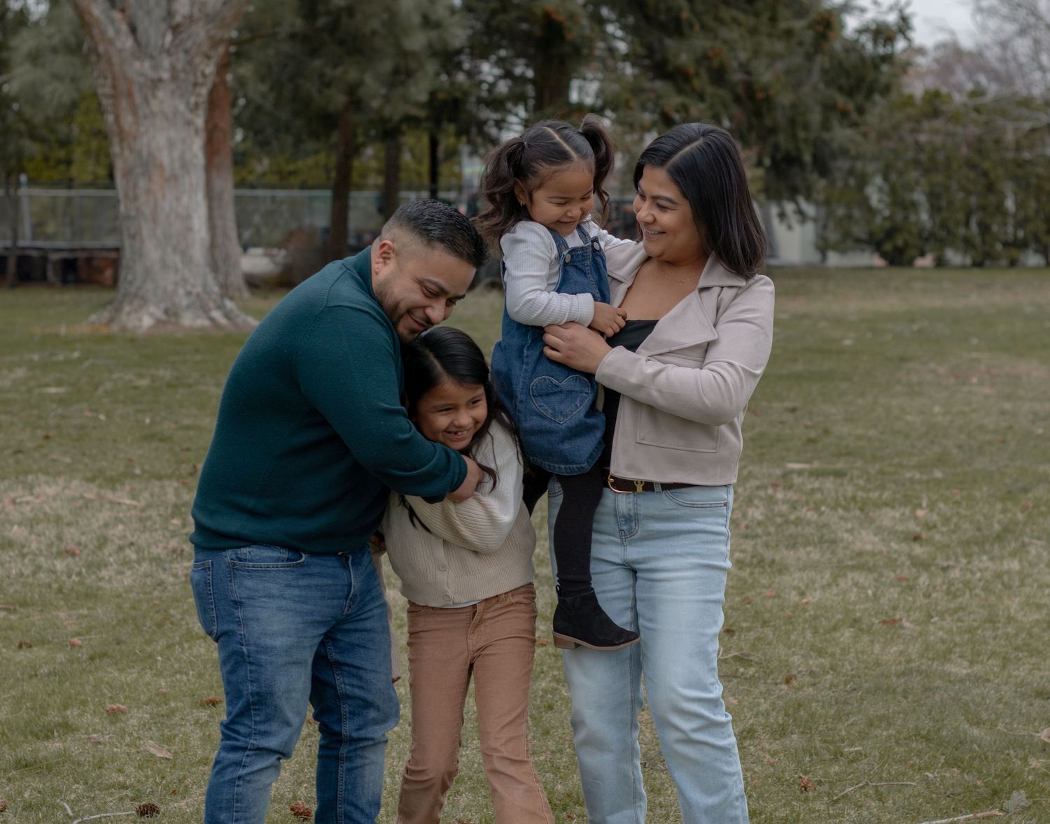 Family of five enjoying a playful moment during a fall photo session in Richland WA