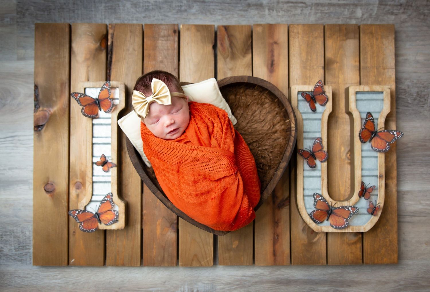 Overhead view of a wooden table with a red-orange object showing movement in a series of sequential photos.
