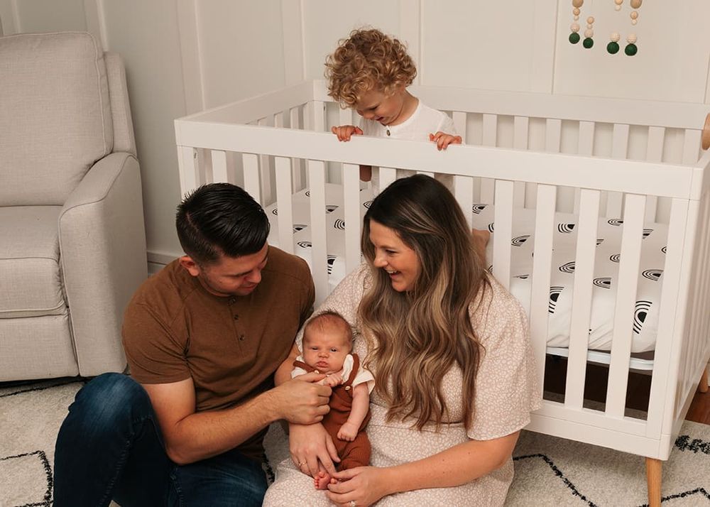 A family shares a tender moment together during an in home family session in Arlington Heights, IL