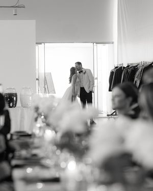 A romantic black and white moment captured through wedding table decor and florals at an elegant reception venue.