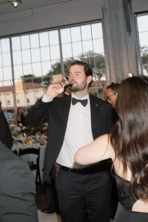 Two people in formal attire sharing an intimate dance at an indoor event.