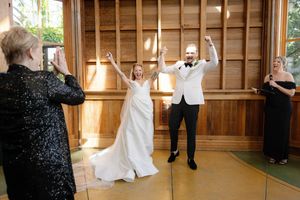 Wedding ceremony space with wooden panel walls and natural lighting.