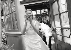 Series of joyful moments captured in black and white during wedding preparations.
