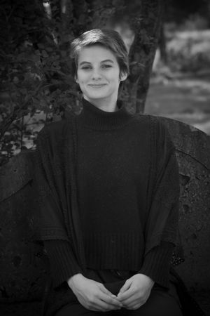 A black and white portrait series shows someone wearing a dark turtleneck sweater against a blurred outdoor background.