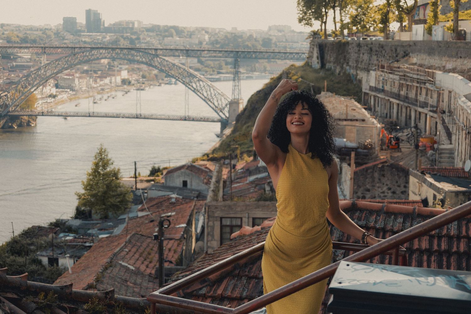 Scenic coastal viewpoint photographs overlooking city rooftops and water.