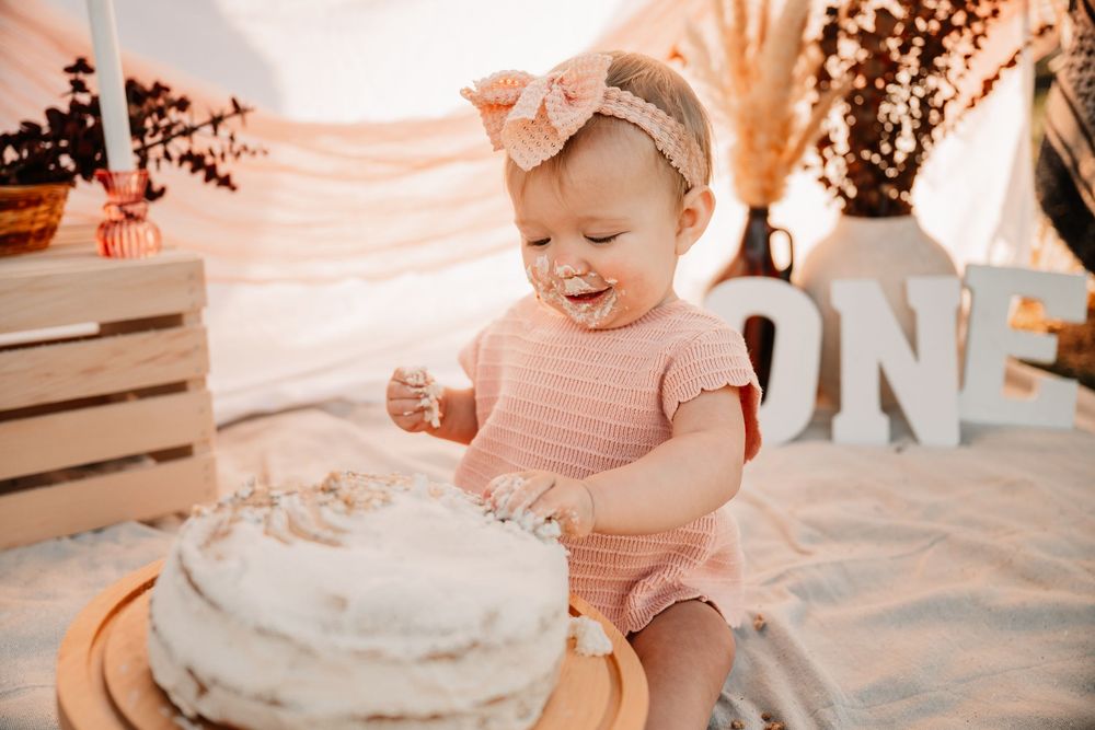 Baby girl one year milestone session in Fort Worth Texas with boho florals and simple white cake