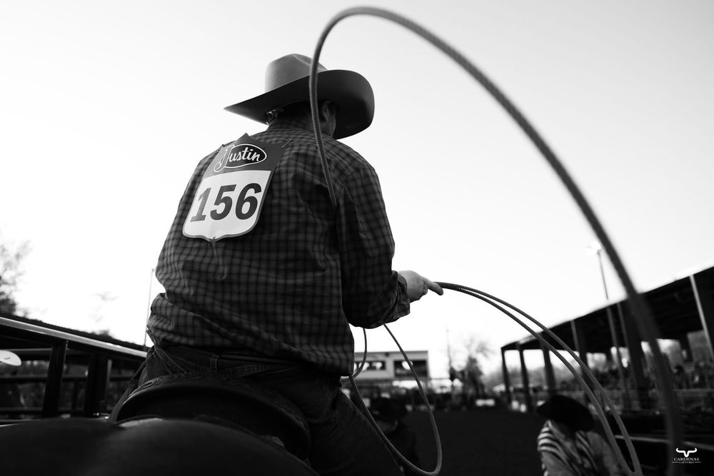 Silhouette of rodeo equipment and structures against a bright sky. Nebraska Pro Rodeo PRCA Rodeo Photographer Dakota Cardenas
