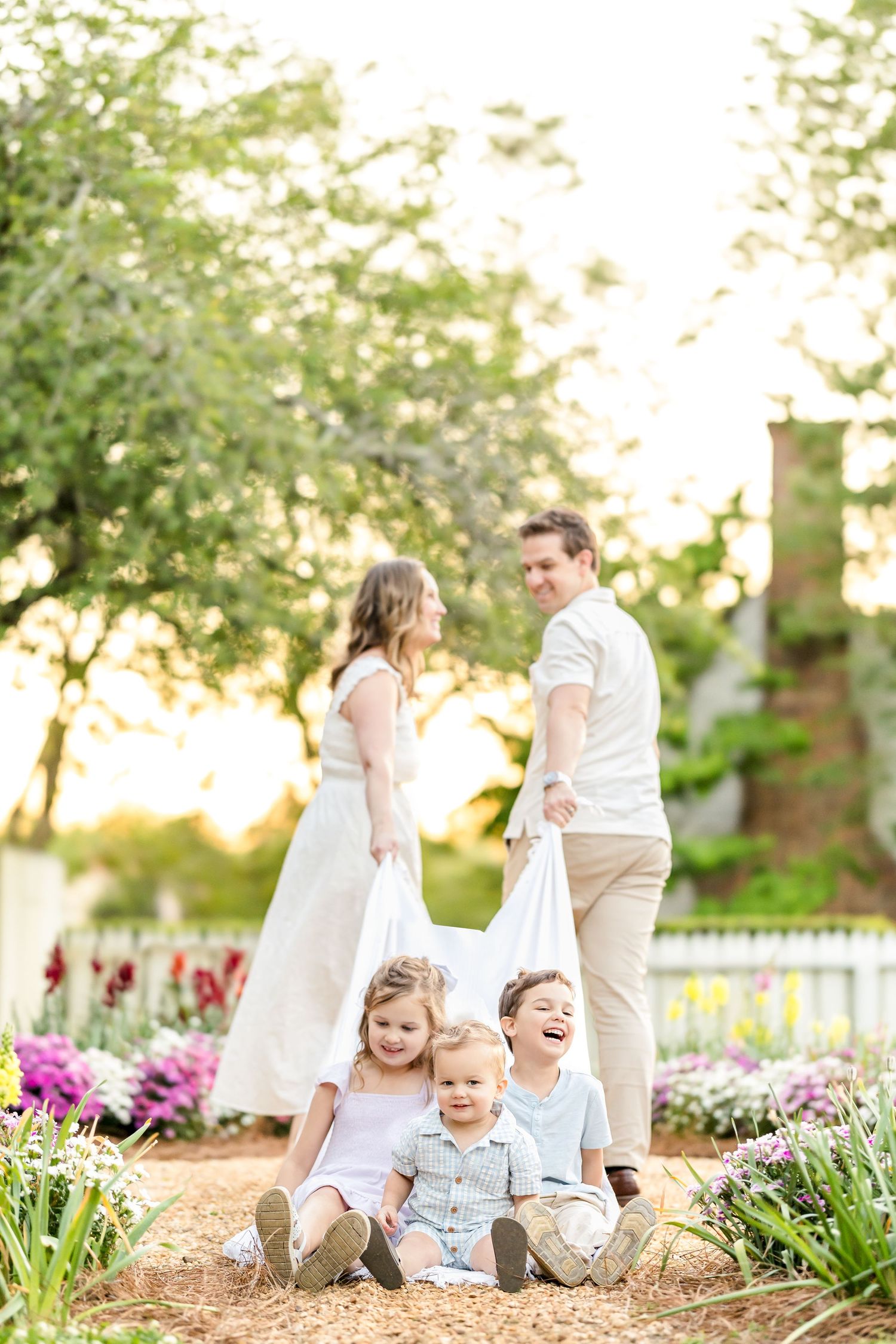 Sample gallery of family photography with small children in a Colonial Williamsburg spring garden.