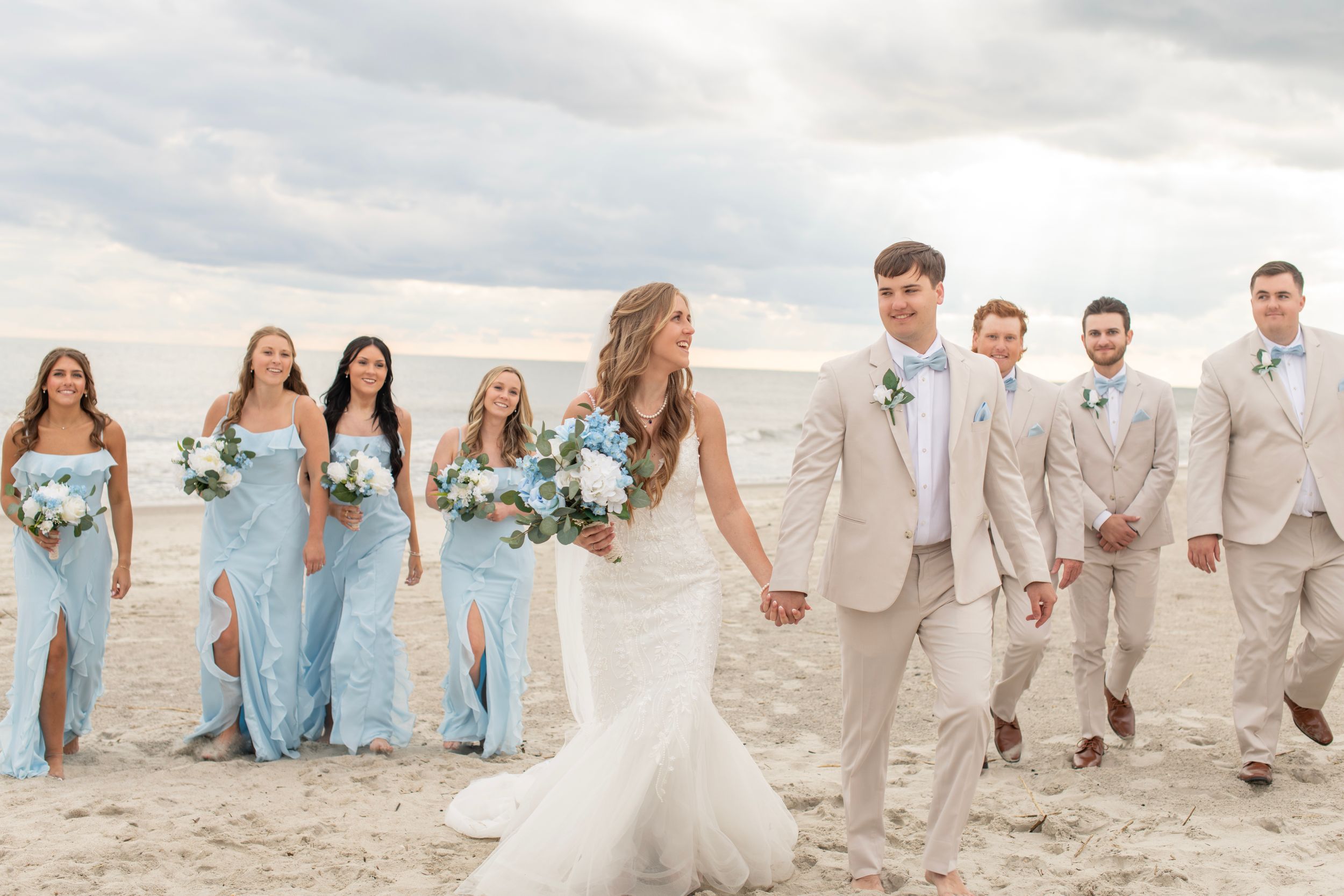 Couple just married at Oak Island, NC beach among their wedding party