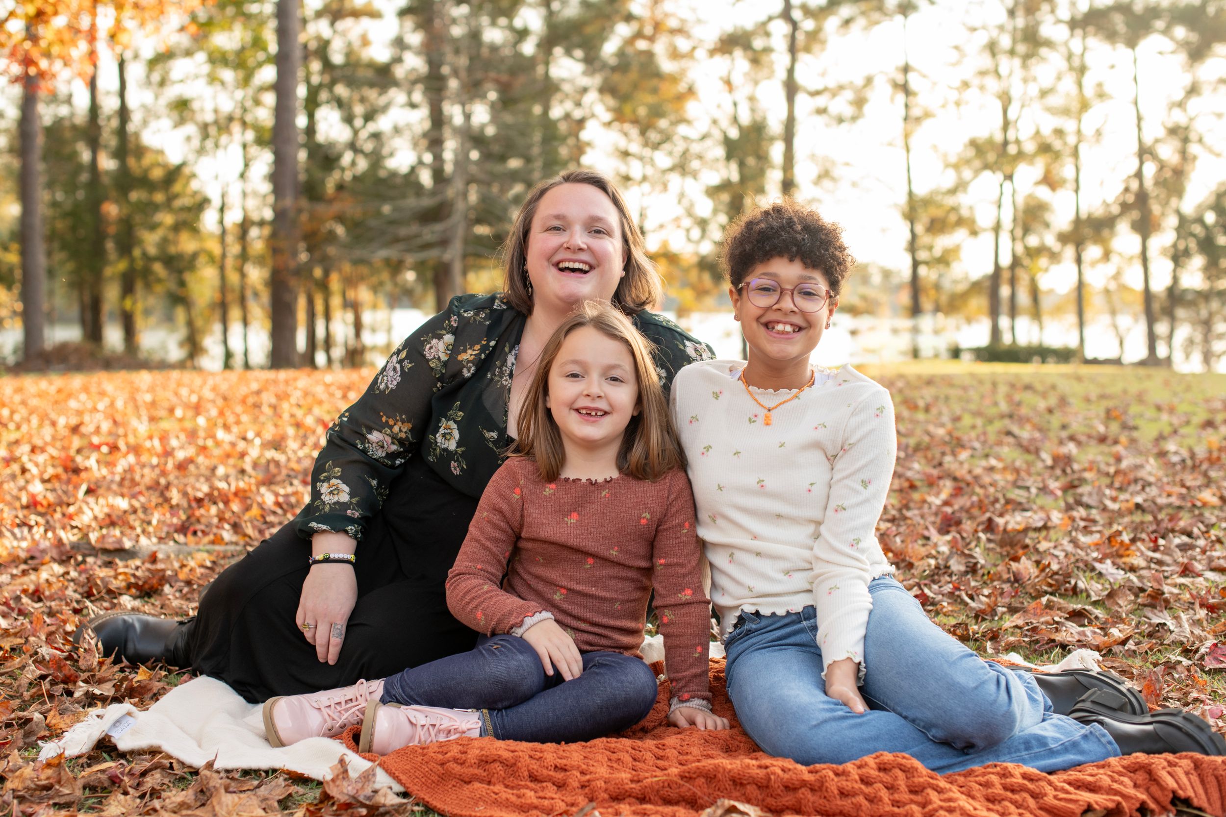 Family poses at Lake Murray, SC during the fall season