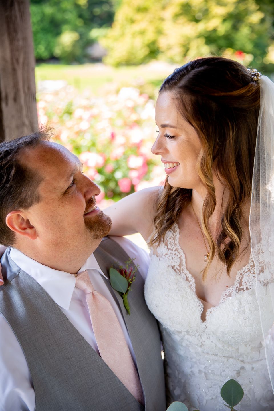 A romantic wedding photo sequence showing a couple embracing and laughing together in formal attire against a bright background.