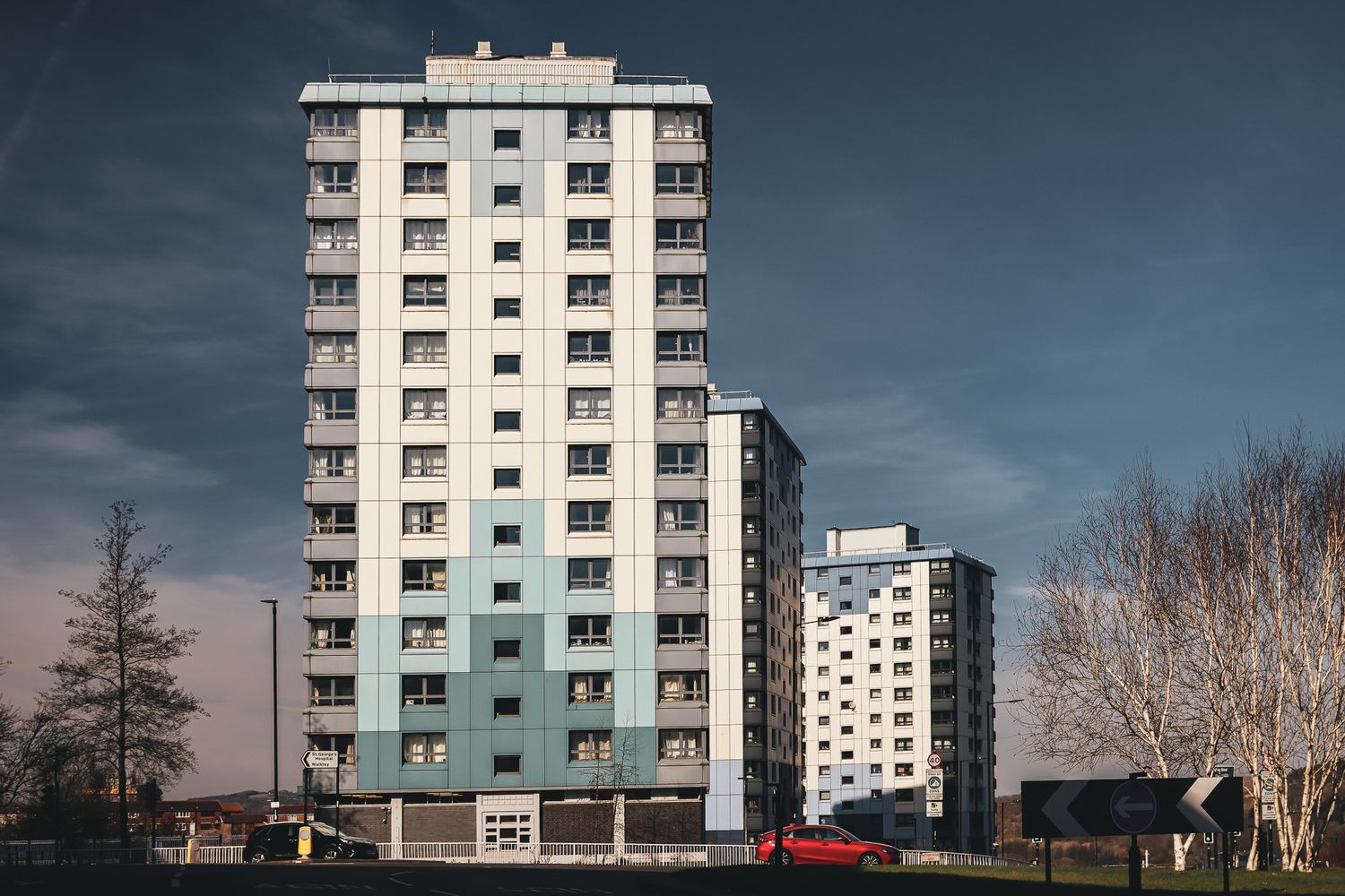 High-rise residential tower block with green and white facade in Sheffield. Netherthorpe Flats - post-war urban redevelopment