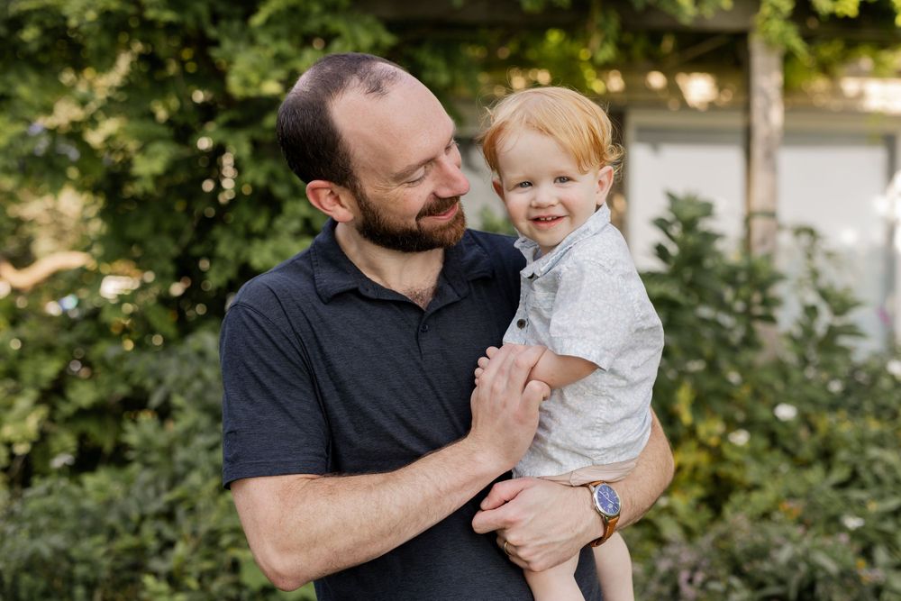 Outdoor photo of dad and son in family session