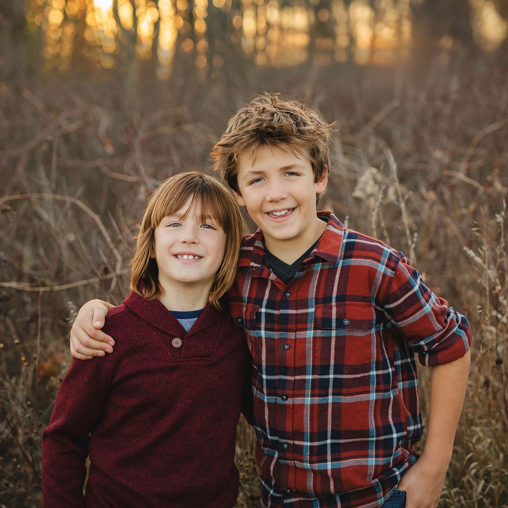 Brothers hugging during photo session in Macomb County, Michigan