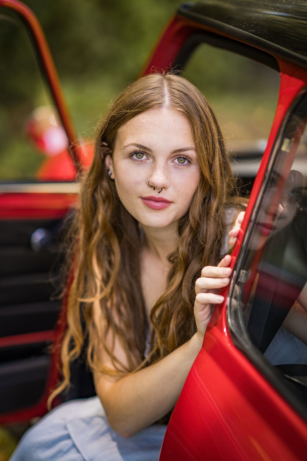 styled photography senior mini session with red classic mini Cooper car and seasonal flowers