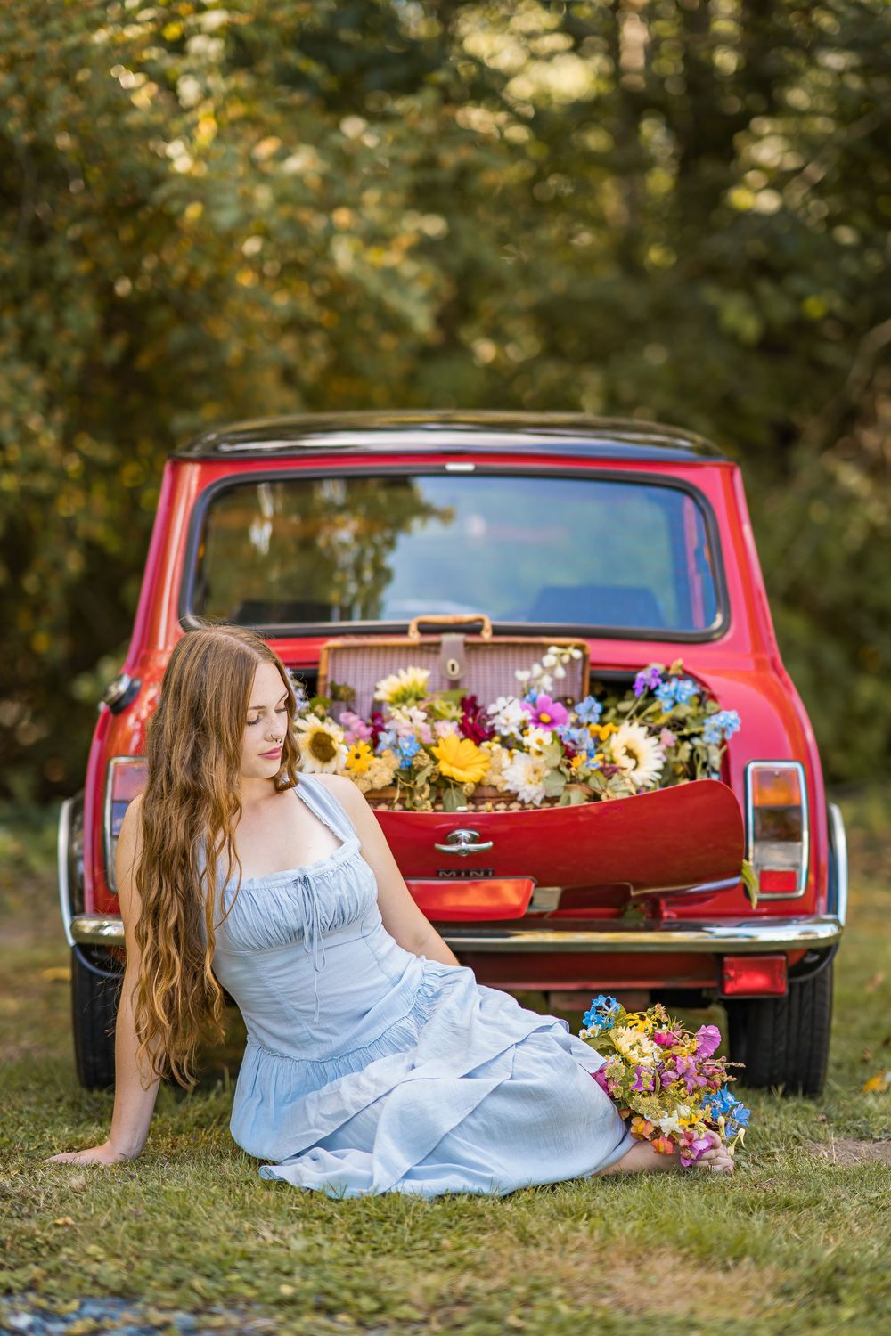 styled photography senior mini session with red classic mini Cooper car and seasonal flowers