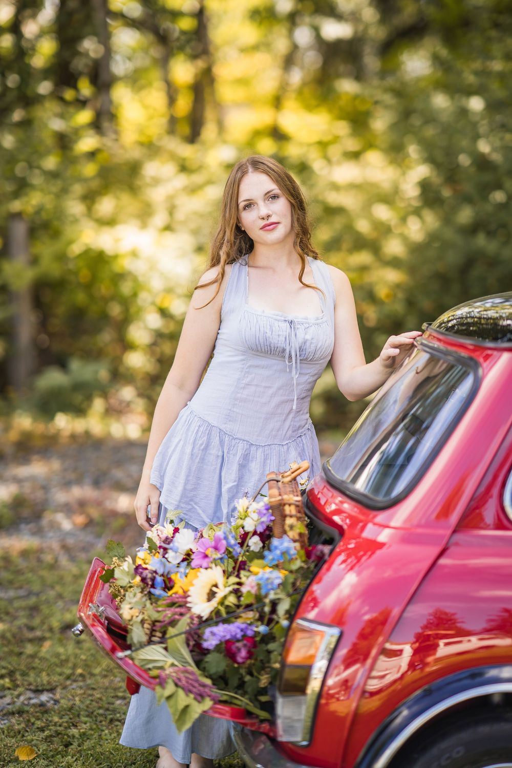 styled photography senior mini session with red classic mini Cooper car and seasonal flowers