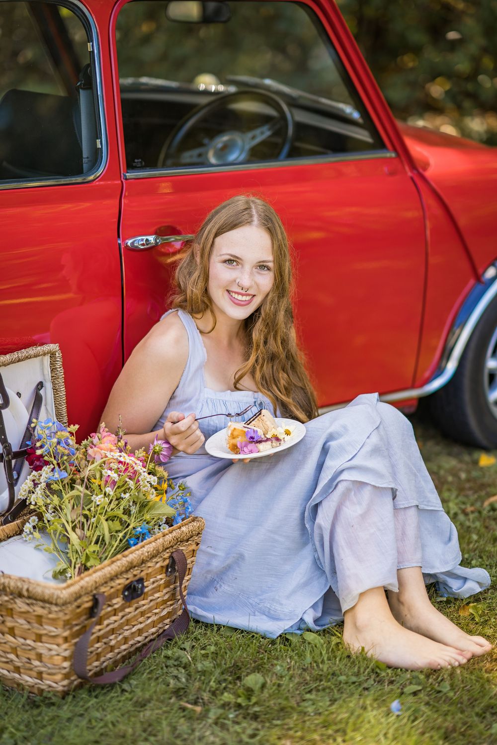 styled photography senior mini session with red classic mini Cooper car and seasonal flowers