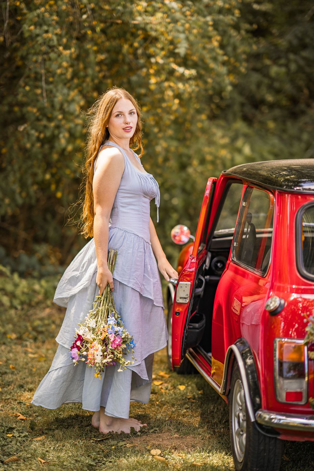 styled photography senior mini session with red classic mini Cooper car and seasonal flowers