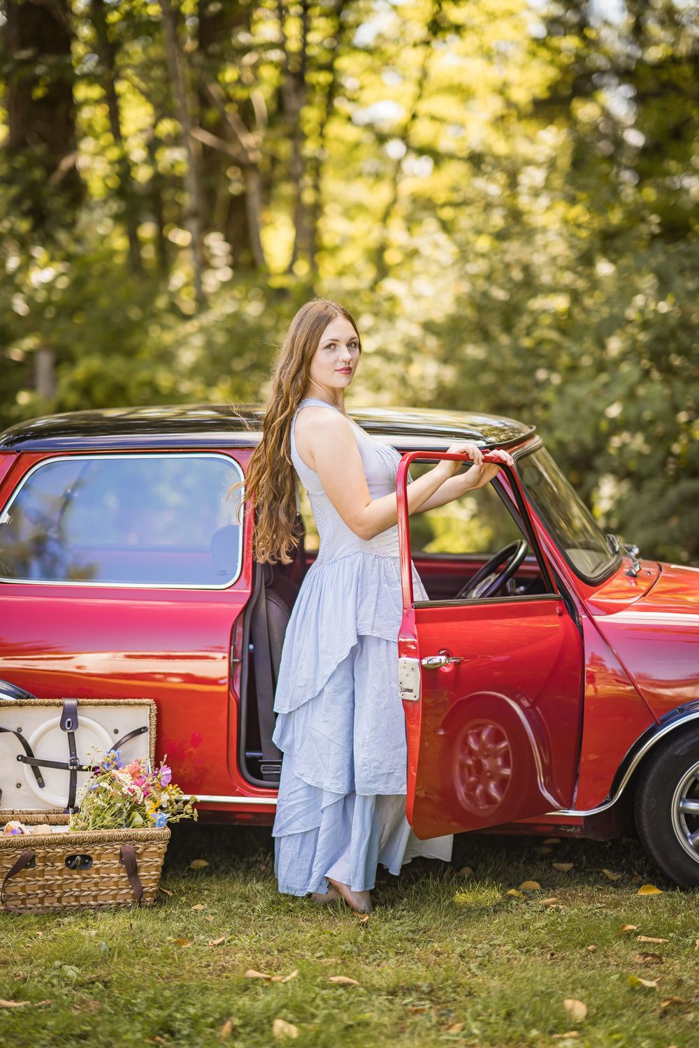 styled photography senior mini session with red classic mini Cooper car and seasonal flowers