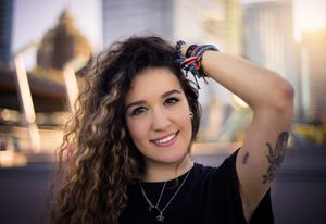 A series of casual lifestyle photos showing someone with dark curly hair in various poses against blurred backgrounds.