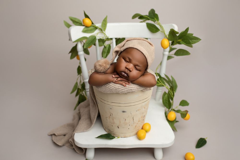 Creative newborn photography Springfield Lakes – baby boy in rustic pot with lemons, affordable newborn portraits for Ipswich and Brisbane