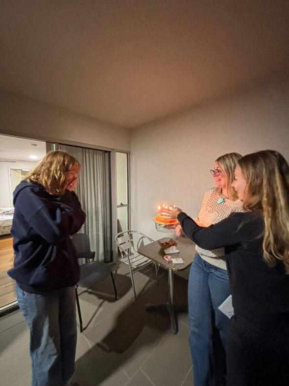 A group enjoying a casual gathering in a modern apartment room.