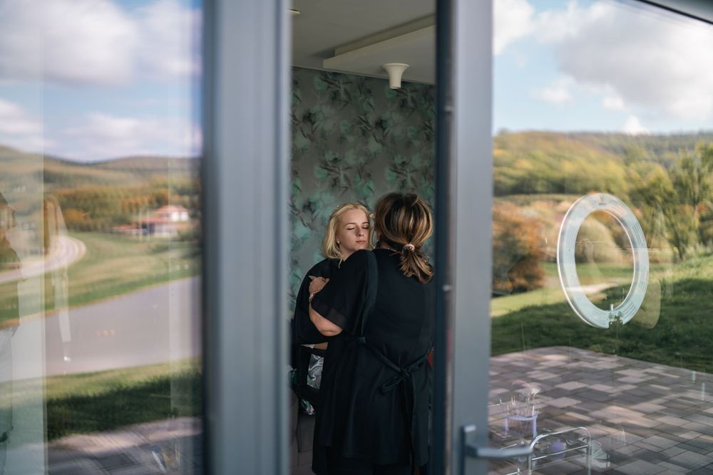 Six vertically-oriented panoramic photos showing misty mountain landscapes viewed through glass windows.