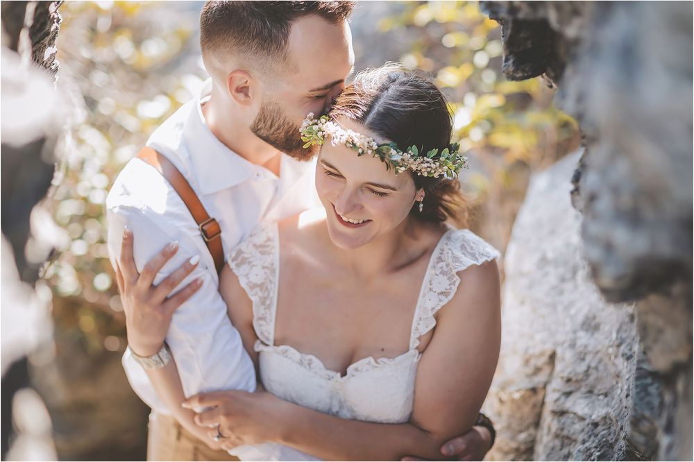 Close-up wedding photography details with mountain scenery in soft natural light.