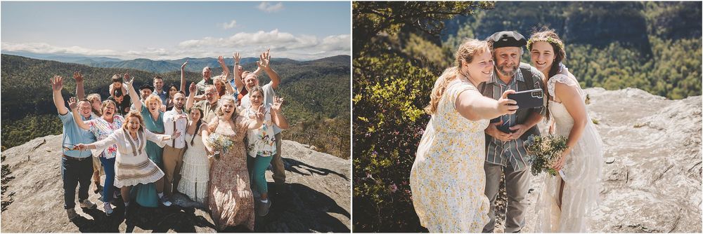 Wedding party poses for group photos on a scenic mountain overlook.