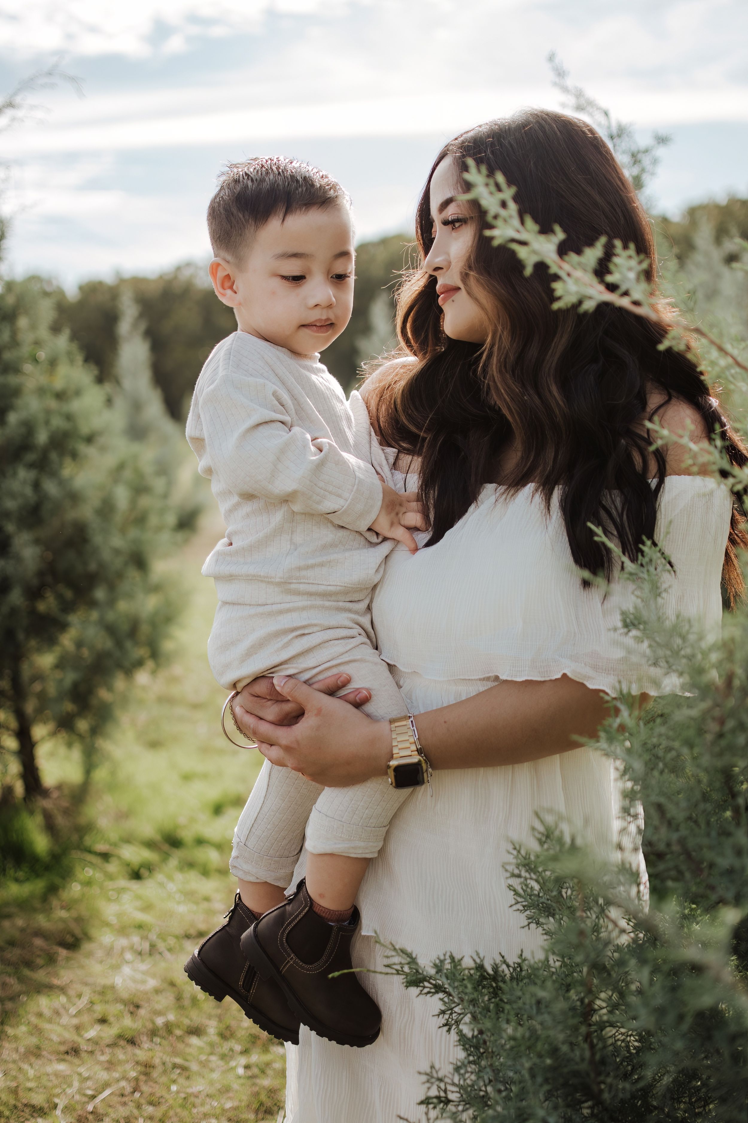 Dfw Tree Farm Intimate family moments captured in a series of candid outdoor photographs.