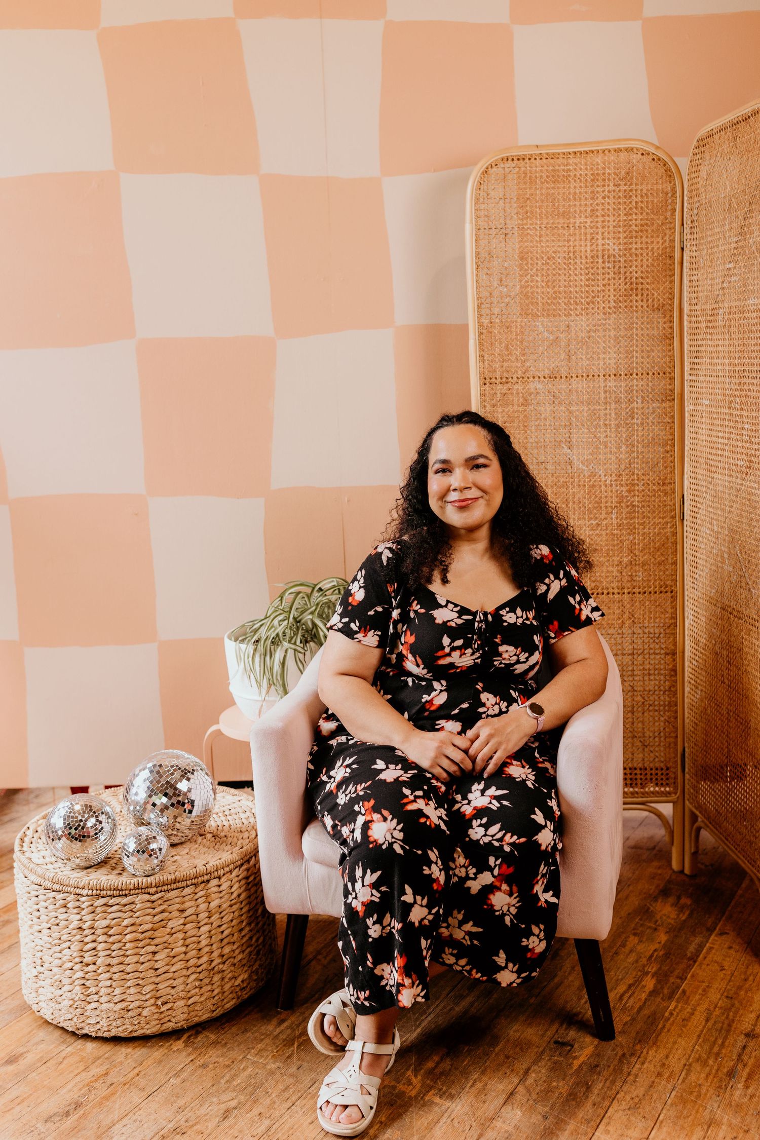 Seattle branding photographer Rochelle Marie sitting with plants at Seattle Content Lab