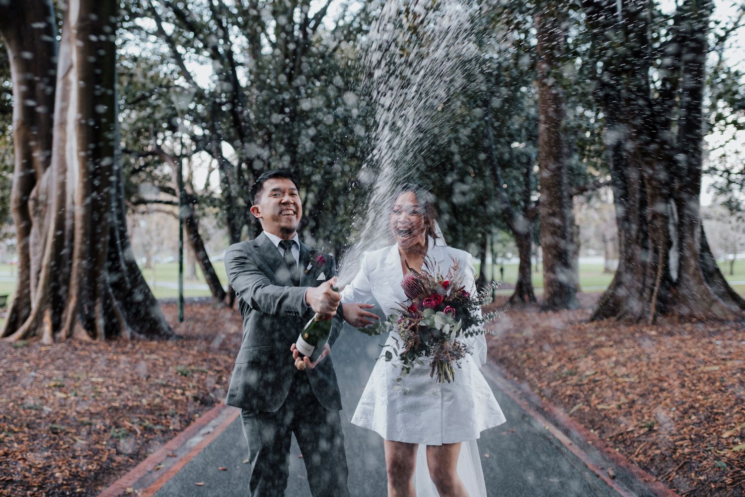 A collection of candid wedding photographs showing a couple enjoying autumn moments in a wooded outdoor setting.