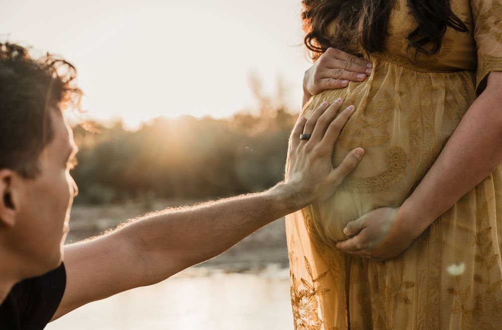 Intimate desert engagement photography with soft golden hour lighting.