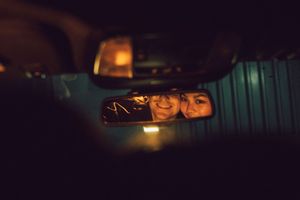 Dark interior shots of a vehicle with moody lighting and reflections visible through the windows and mirrors.