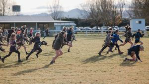 Kids running for a lolly scramble in Rotherham, rural North Canterbury
