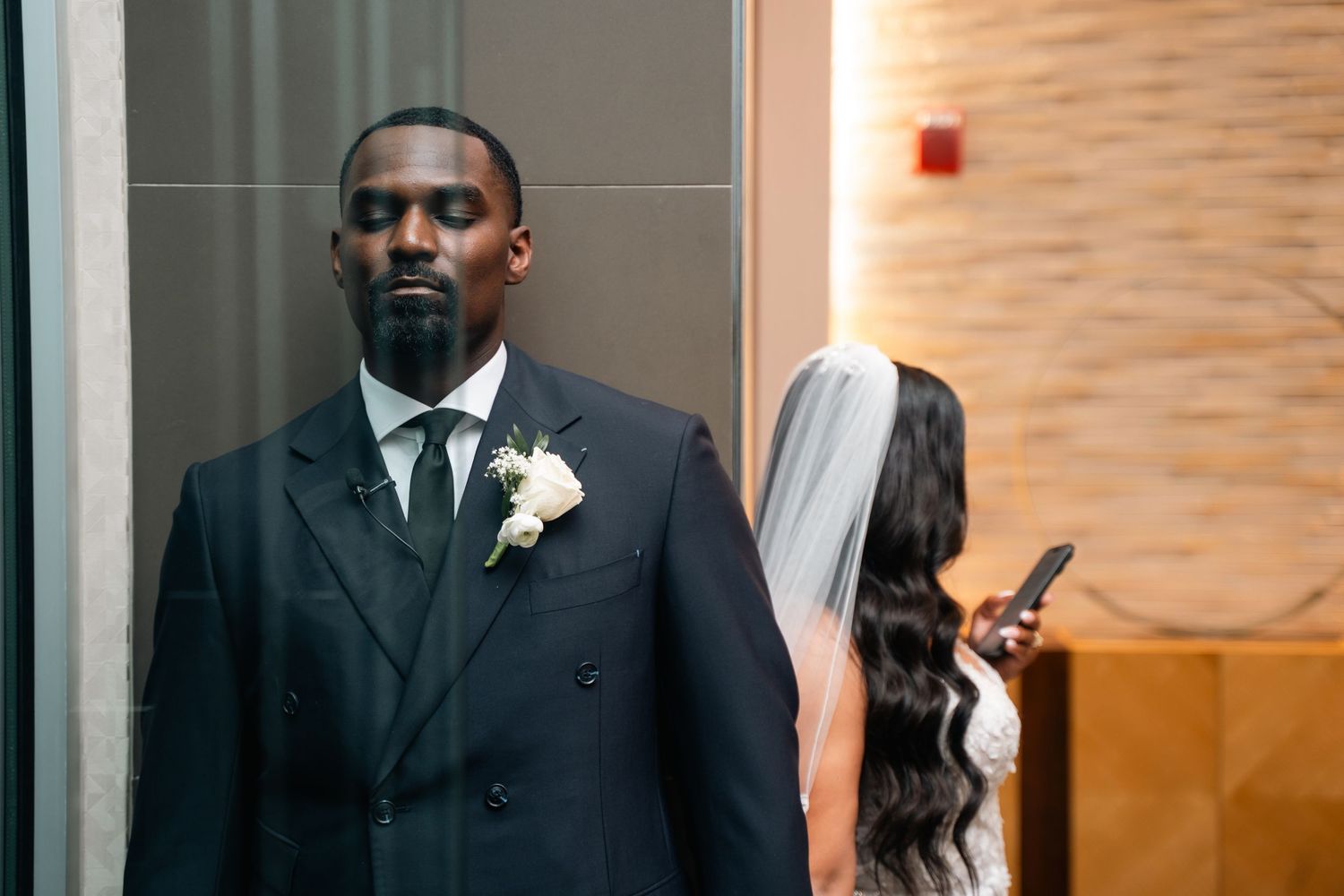 Bride and groom share an intimate first look before their wedding ceremony.