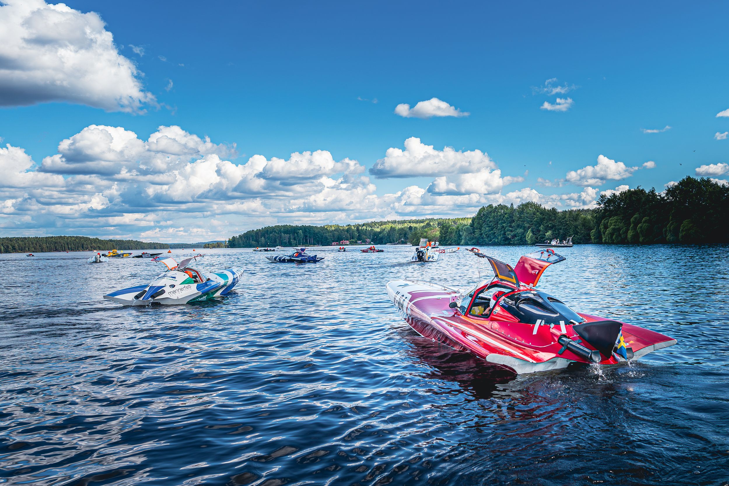 High-speed powerboat racing action shot from a water motorsport event. Perfect for sports coverage, event promotion, and adrenaline-fueled b