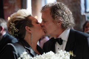 An elegant black tie wedding celebration moment captured indoors.