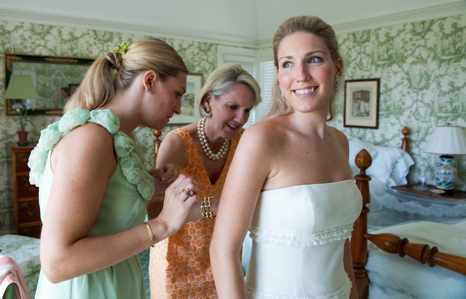 Wedding preparations in a bedroom with floral wallpaper and traditional decor | photo by Tom McCall Photography | Eastern Shore MD Photo