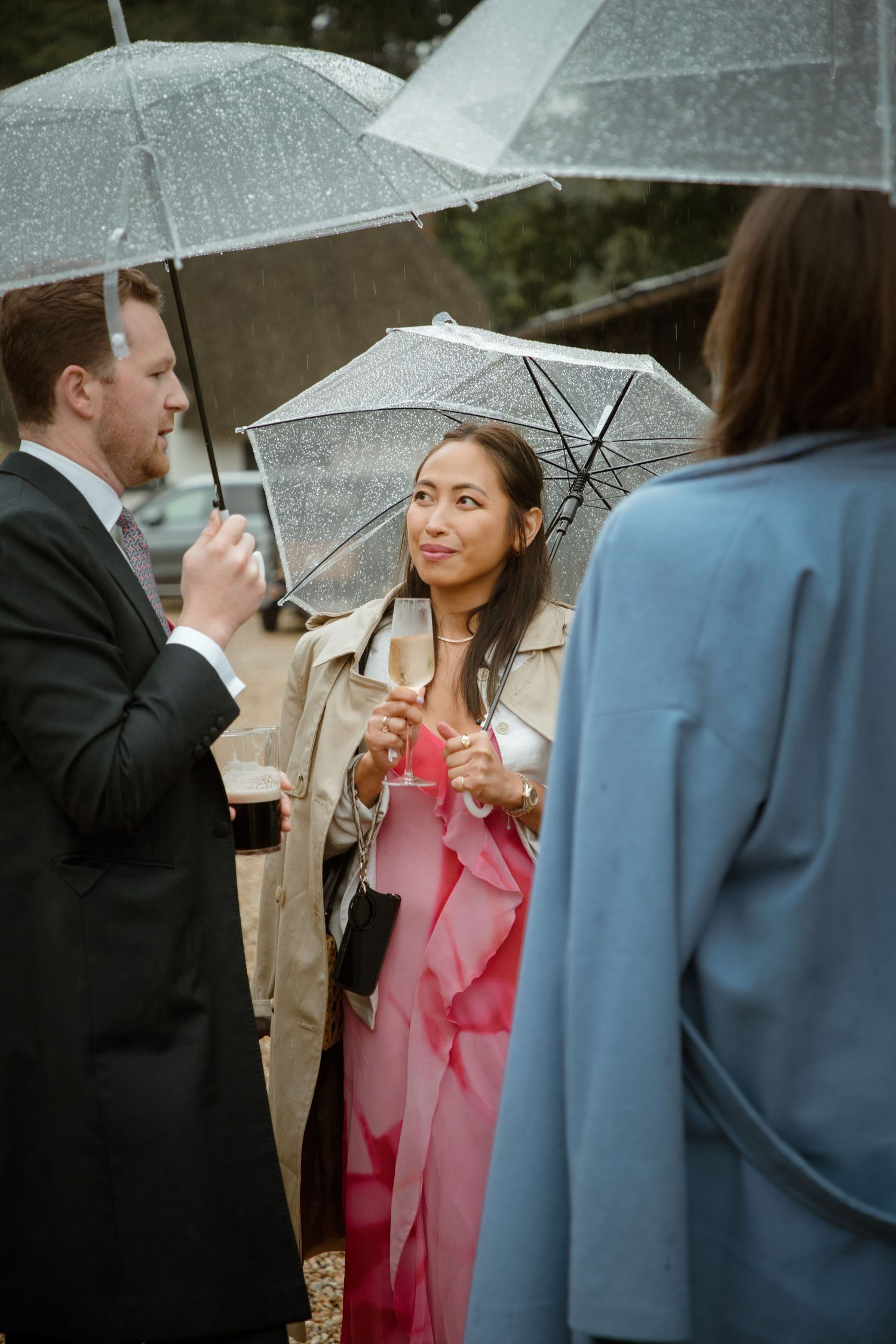 rainy wedding perfect conversation company wedding guest mingling candid photography