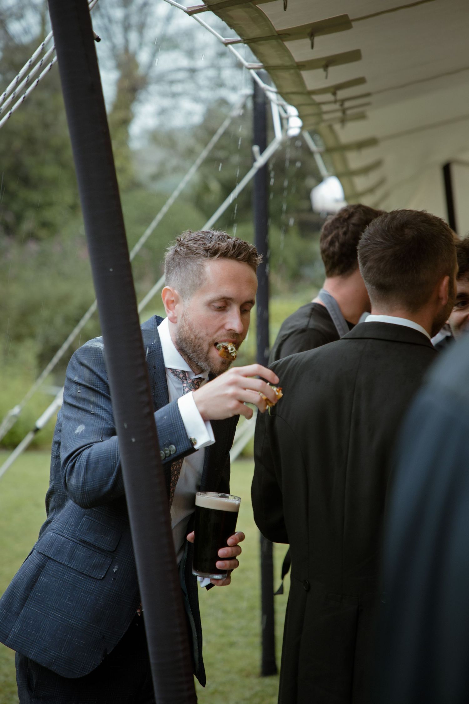 Canapés Guinness cocktails wedding guest enjoying wedding photography
