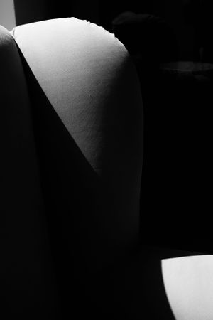 Abstract black and white photograph showing curved architectural shapes and shadows.