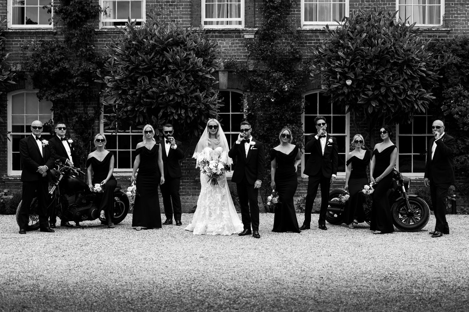 Formal group shot with an edge. Mob family Wedding party inspired.