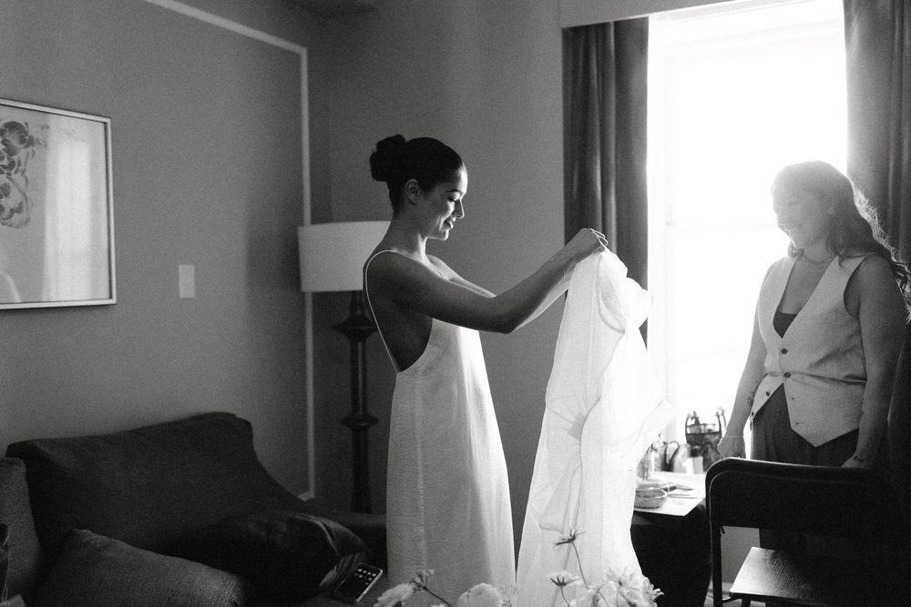 A series of black and white images showing preparation moments before a wedding ceremony.