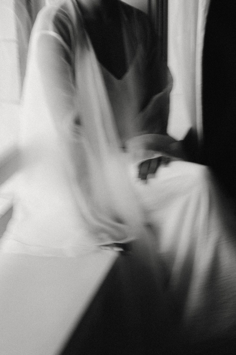 Abstract black and white motion blur photographs creating an ethereal effect.
