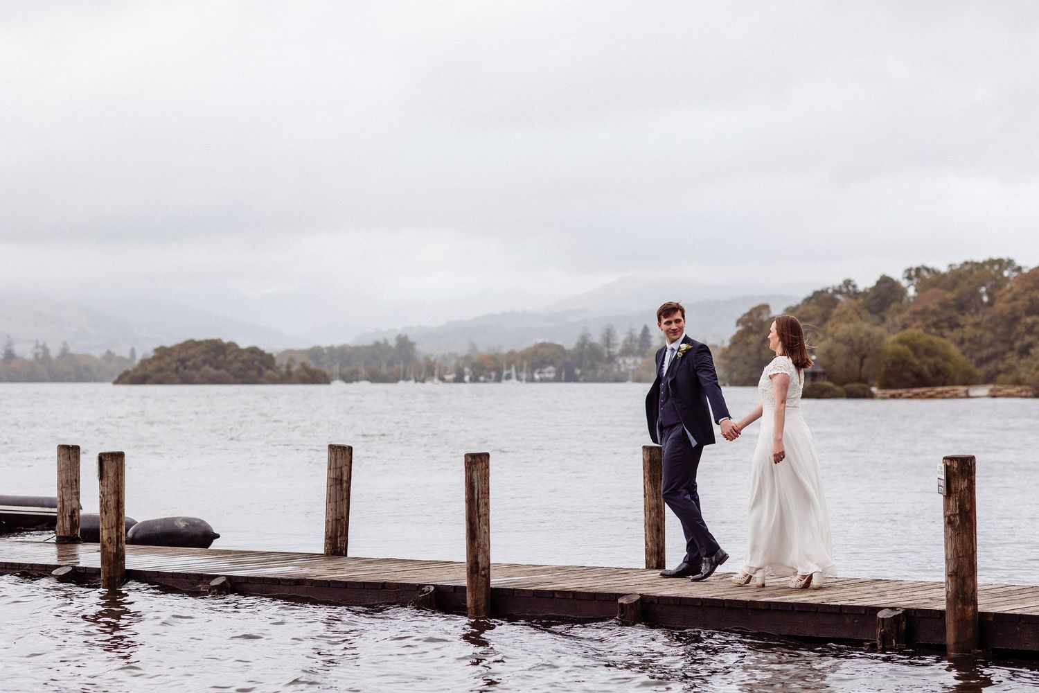 Couple on the lakeshore at Storrs Hall on Lake Windermere