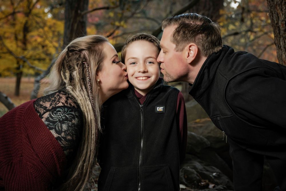 Family fall portraits take at Finch Arboretum in Spokane Washington.